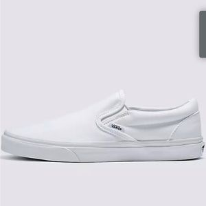 White canvas slip on Vans.